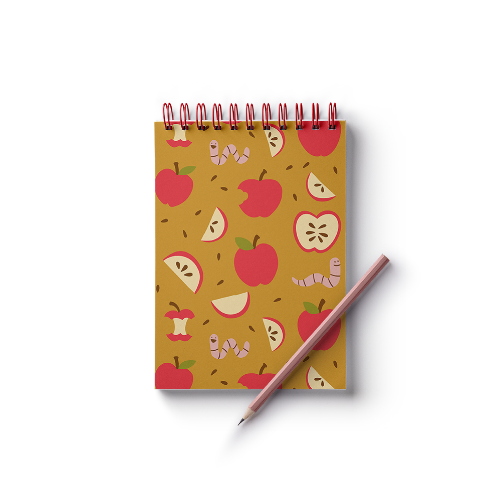 Mockup of a notepad with pattern of apples and worms