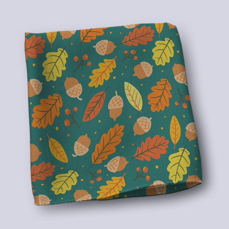 Folded bit of fabric with oak leaves and acorns pattern