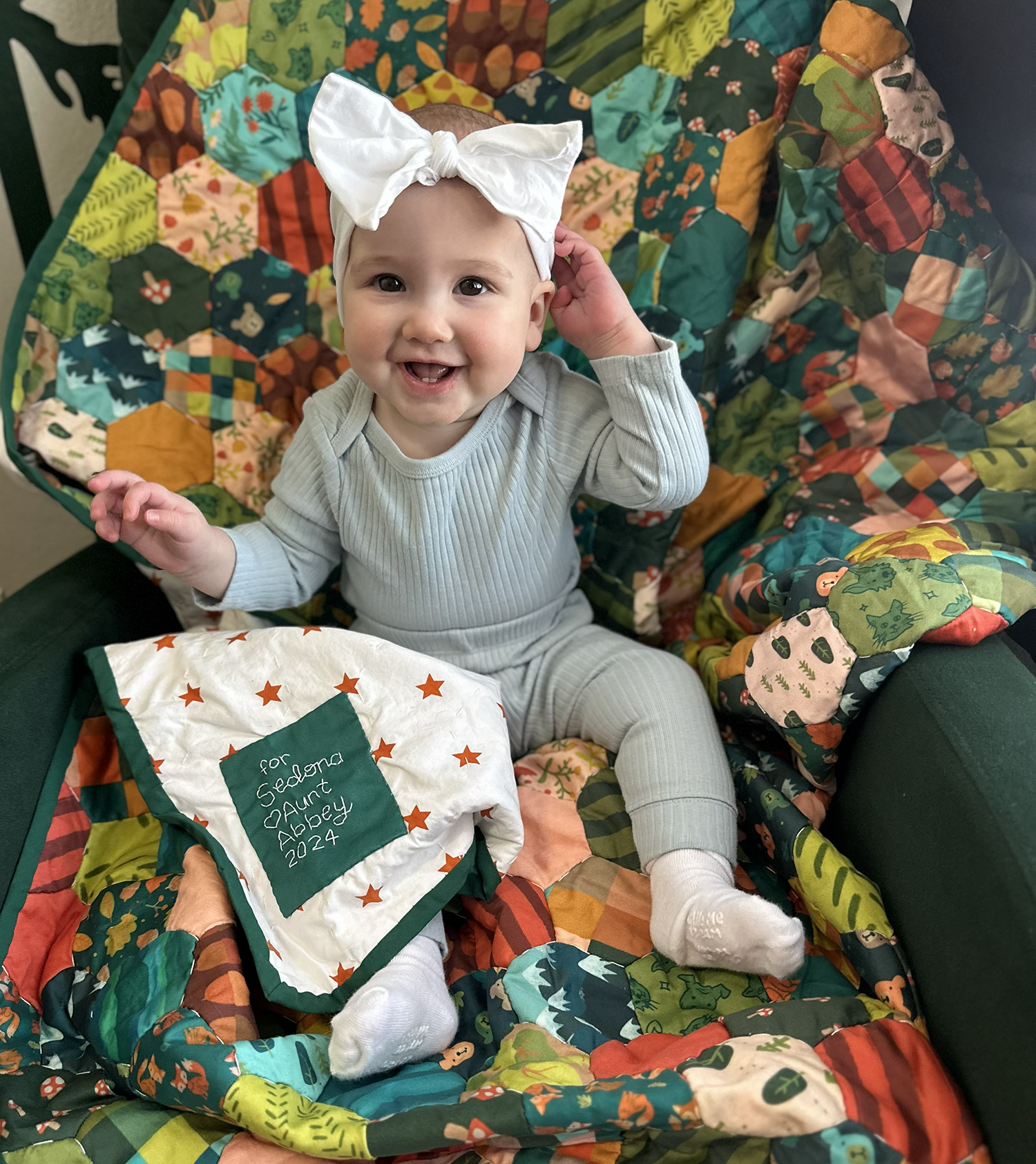 Baby Sedona with her completed quilt