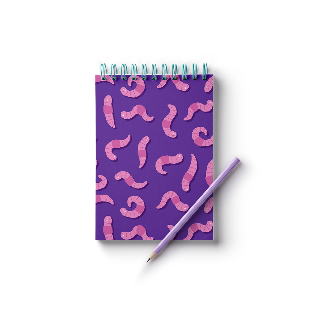 Notepad with pattern of pink worms on purple background