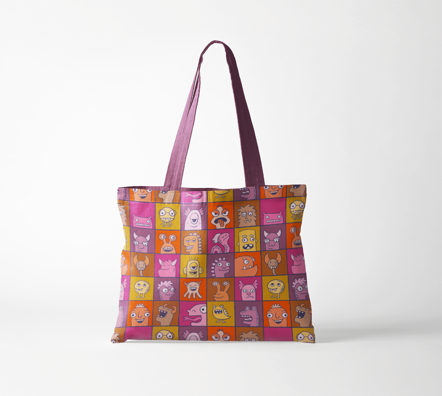 A brightly colored illustrated pattern of monster in individual boxes mocked up on a tote bag
