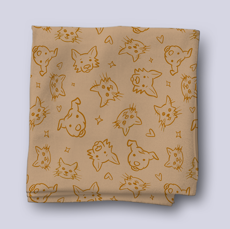 Folded bit of fabric with pattern of two dogs and two cats
