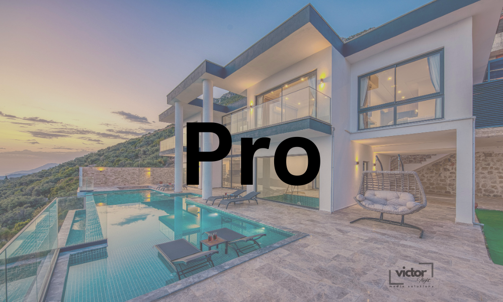 Modern house with outdoor swimming pool and balcony, hillside view at sunset.