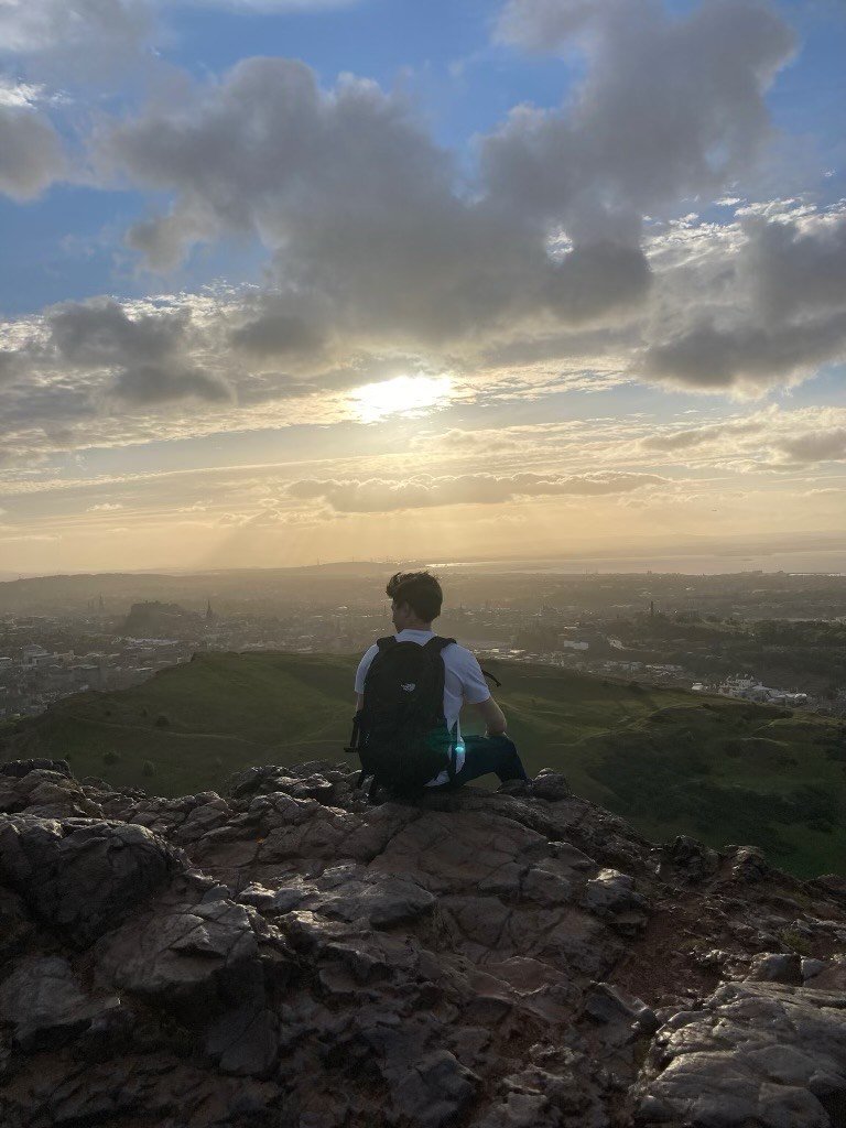 Harrison enjoying the view on Arthur's Seat in Scotland.