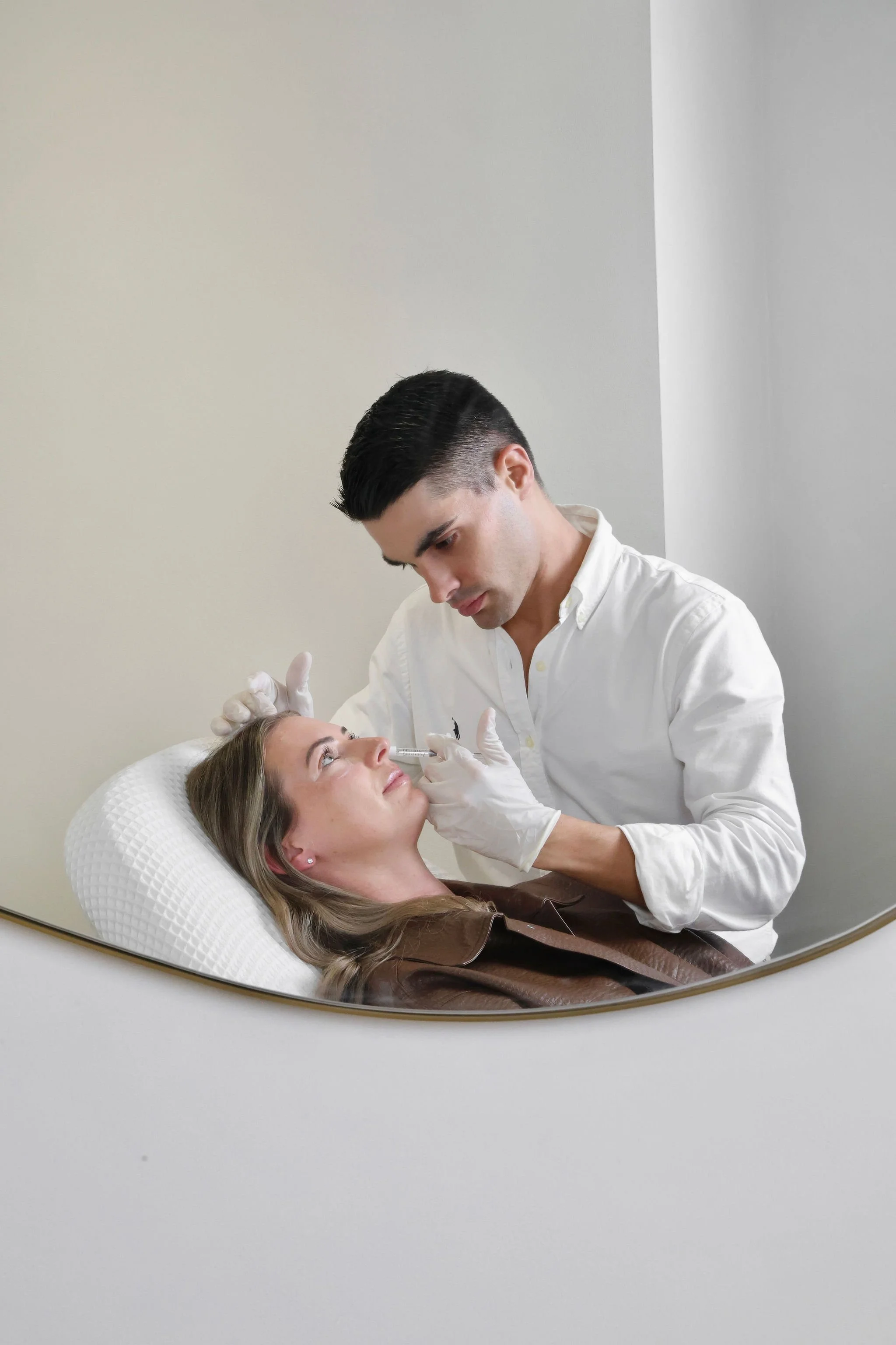 Joe Fenech treats a client at Face Factor in Bondi Junction in Sydney's Eastern Suburbs. Face Factor is a clinic specialising in personalised clinical skin treatments.