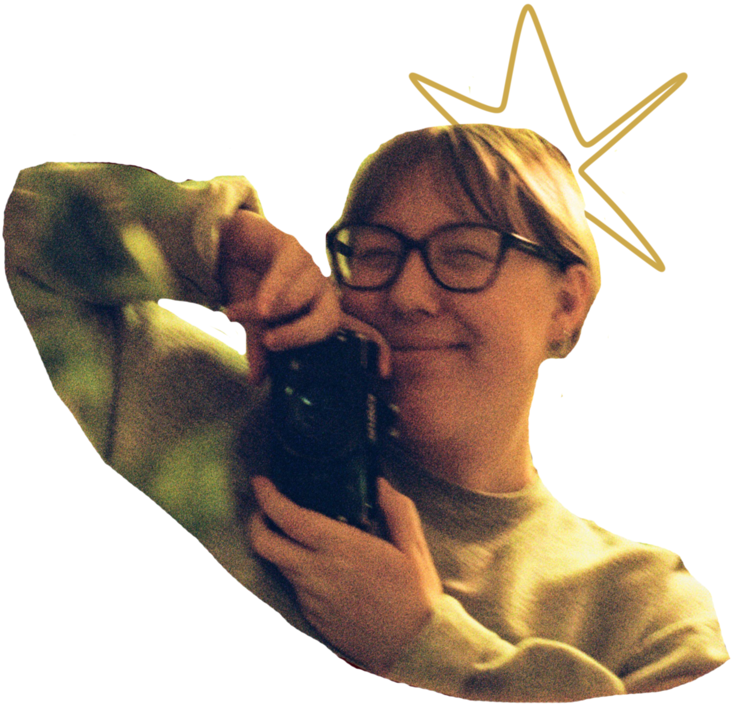 Person with glasses smiling while taking a selfie with dog.