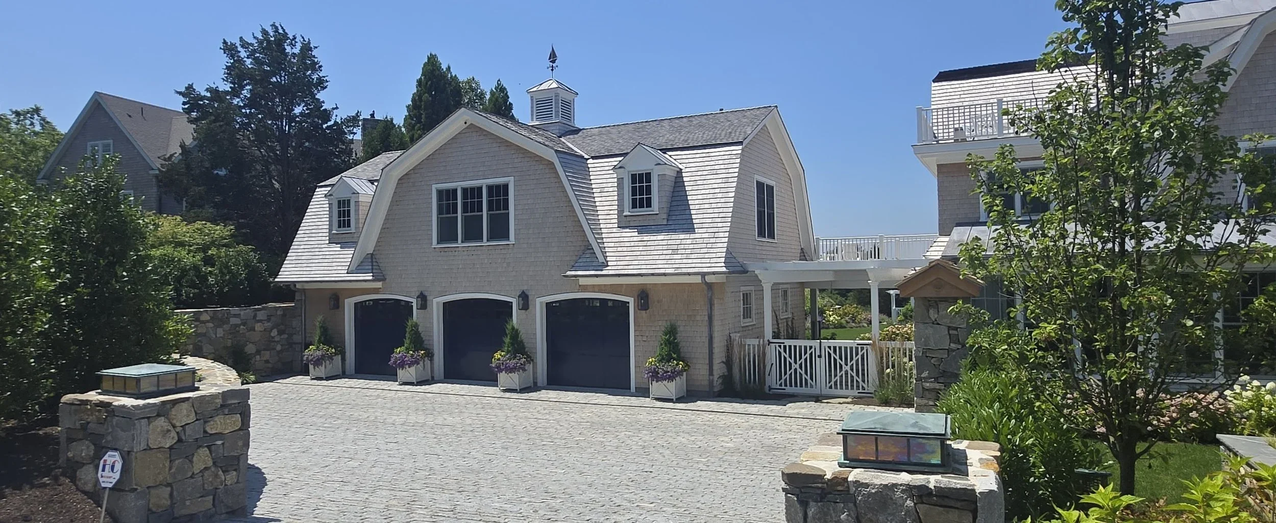 02-Walnut-wood-roofing-shingle-siding-jamestown-RI-slate-and-copper.webp