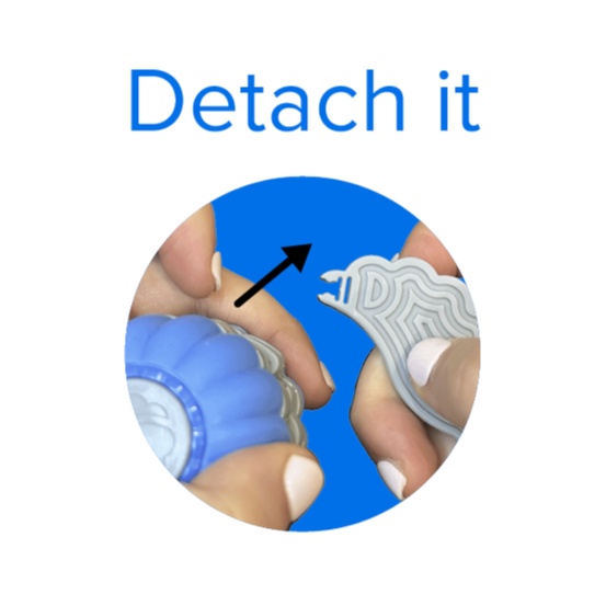 Close-up of hands detaching a wing piece from the SIDEKICK™️. The image emphasizes the action of detaching a wing.