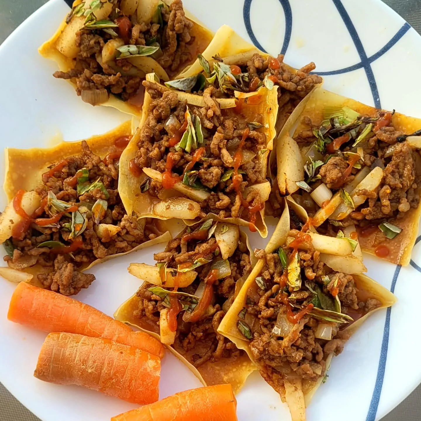 A fun and easy meal from @buzzfeedtasty Thank you!. 
I paired these with local carrots 🥕 and basil from my garden Yum! 😋 I followed @pfchangs lettuce wrap recipe for the filling. Homemade chili oil courtesy of @nickel45 🥰