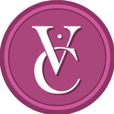 Purple circular logo with interlocking white letters V and C representing a local jewelry store named Victoria Charles Jewelry in Richmond, VA. .