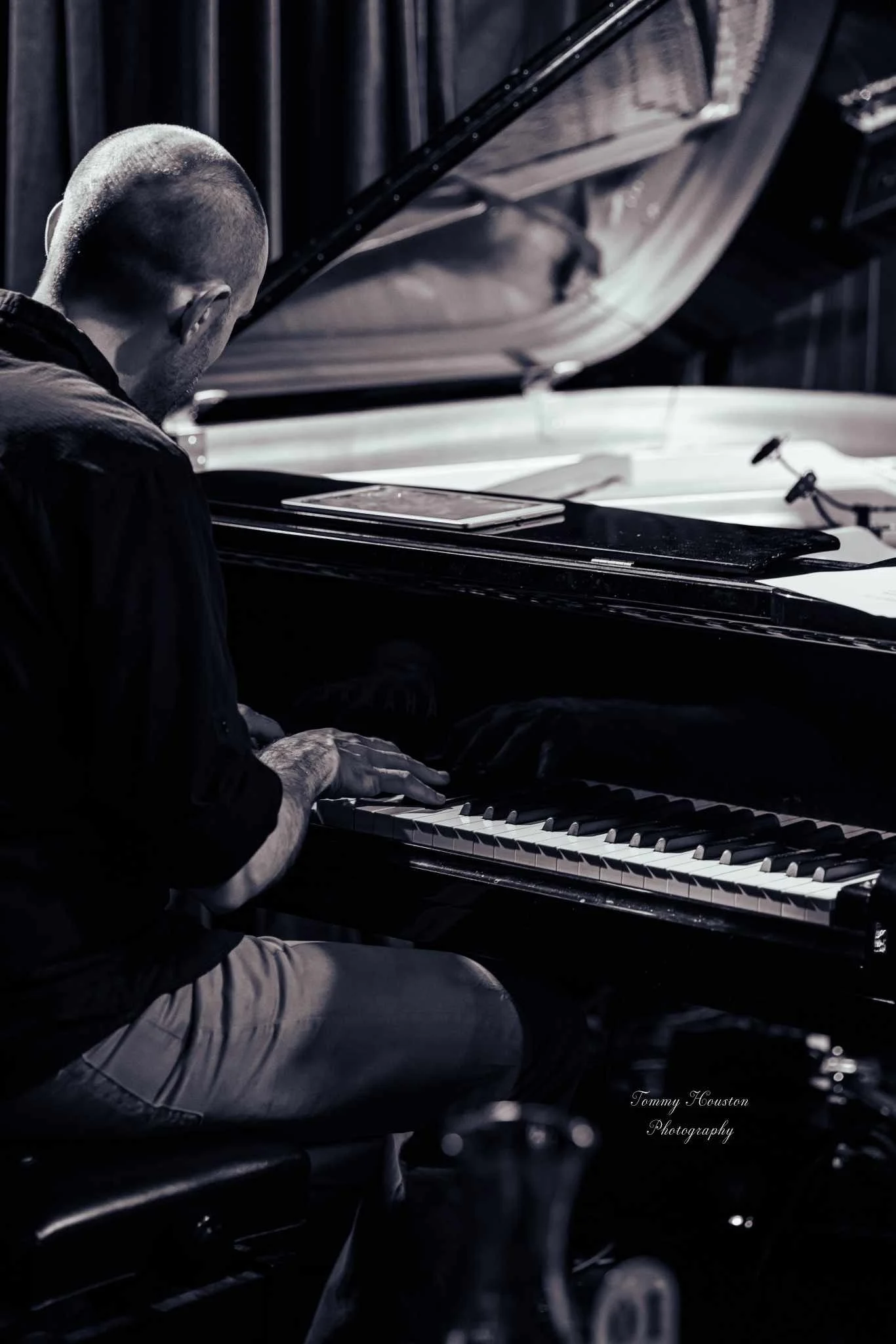 Todd Marston playing a baby grand piano