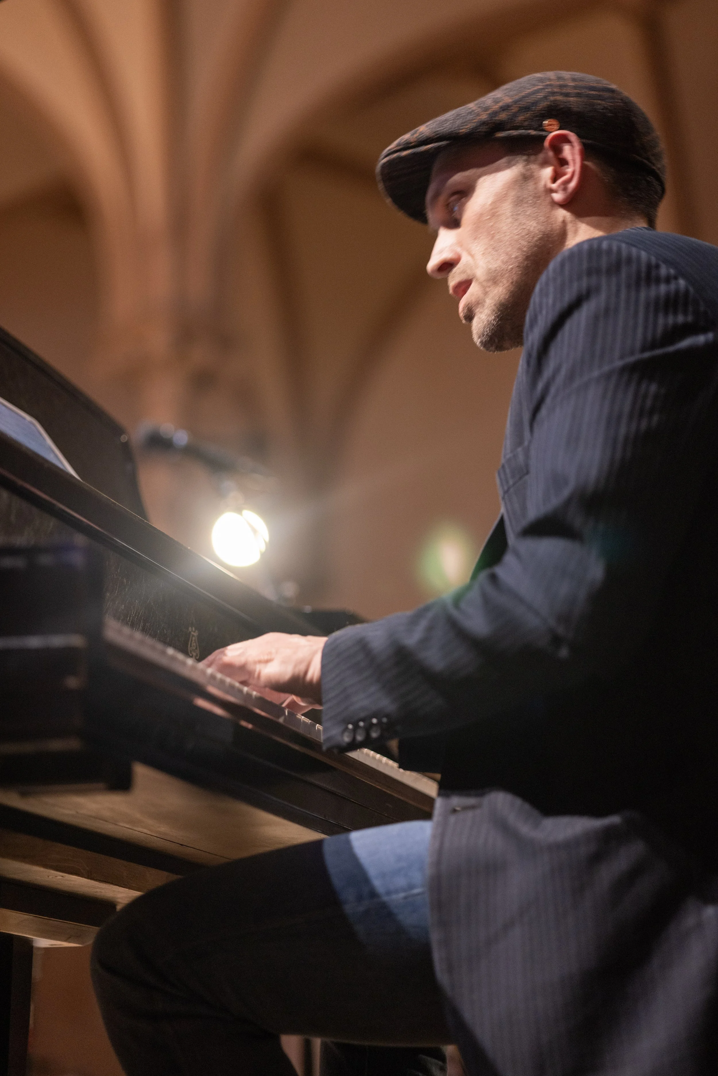 Todd Marston playing piano in a concert hall