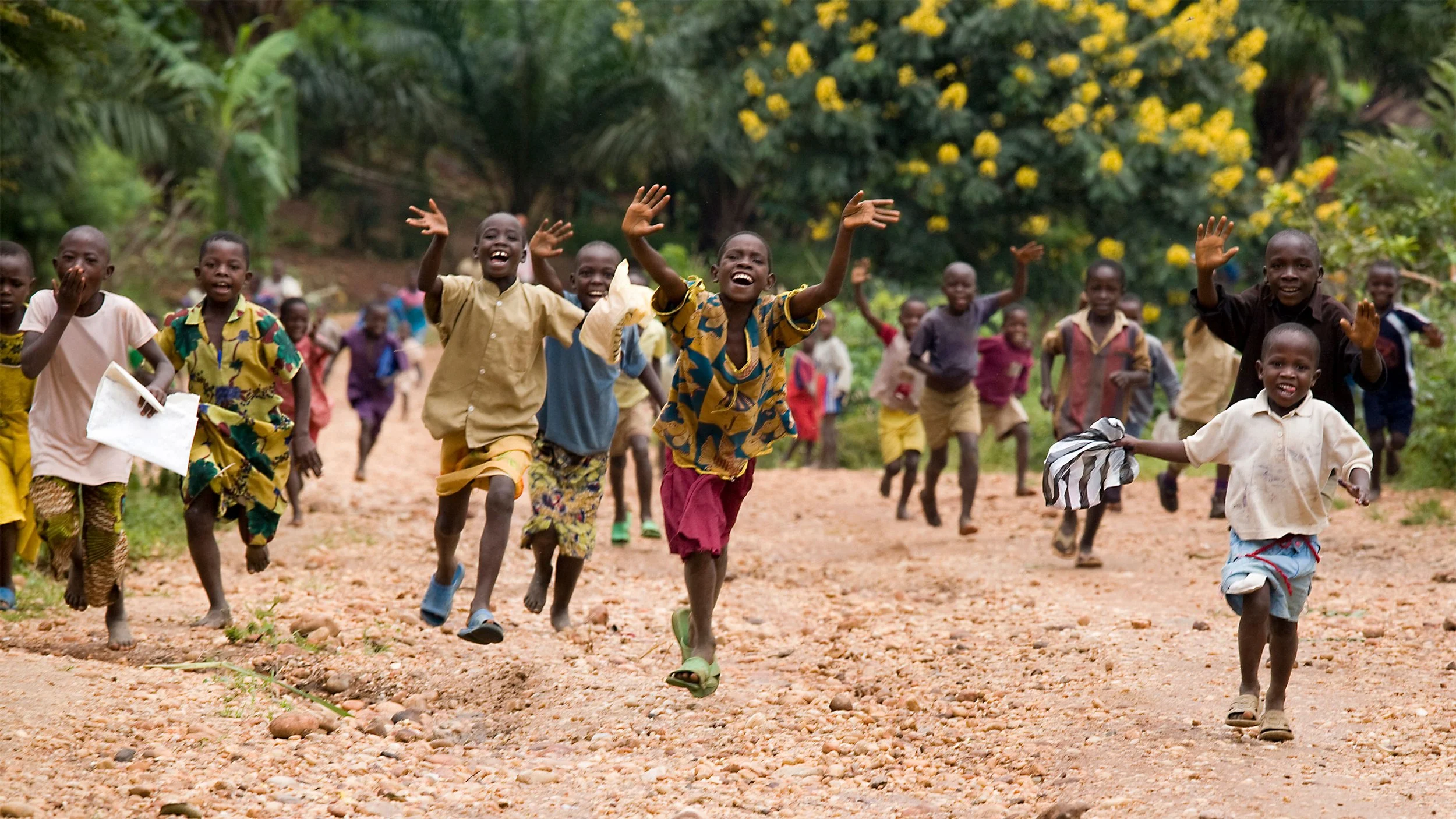 joyful-children-running-down-a-dirt-road-amidst-vi-2025-04-05-03-50-29-utc_EDIT.jpg