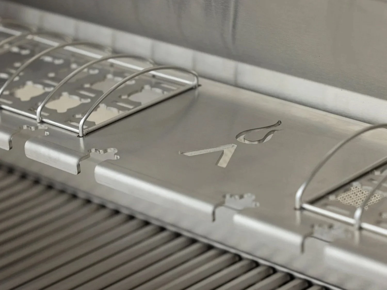 Close-up of Blaze LTE PRO flame-stabilizing grids and stainless steel cooking surface in Houston luxury outdoor grill