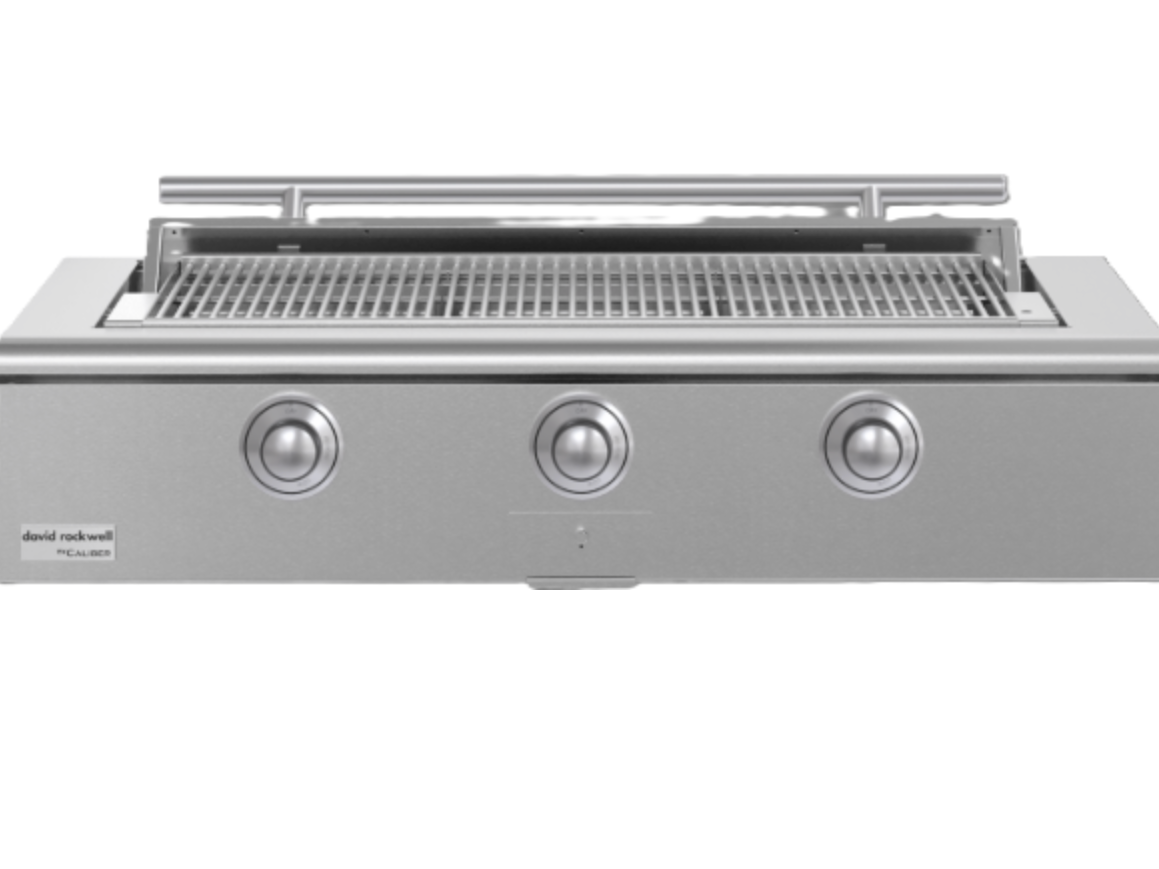 Caliber 48-inch Rockwell grill with disappearing lid open in a Sugar Land outdoor kitchen