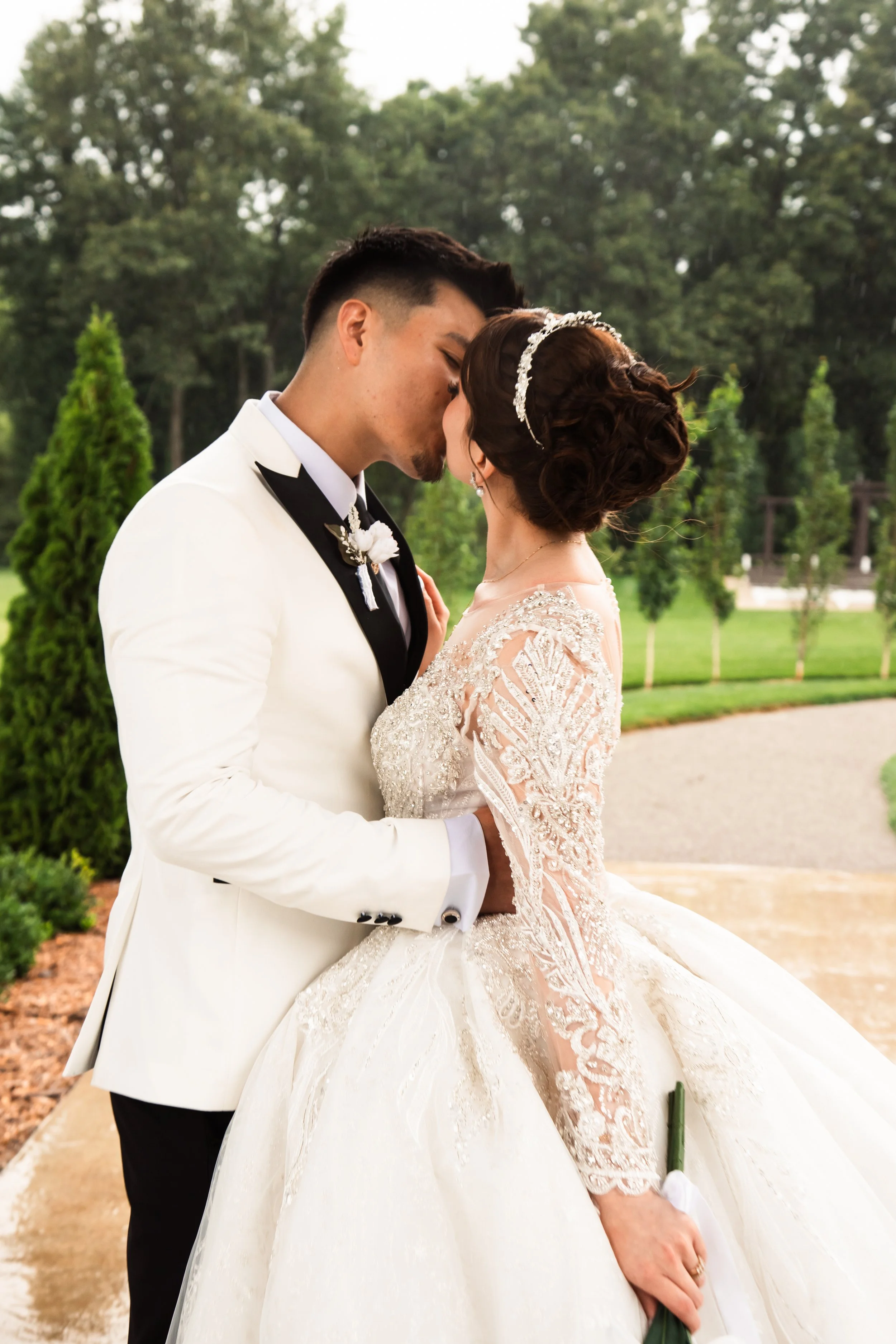 Laurie’s customers, Fernando and Kate embracing by the lake on their wedding day.