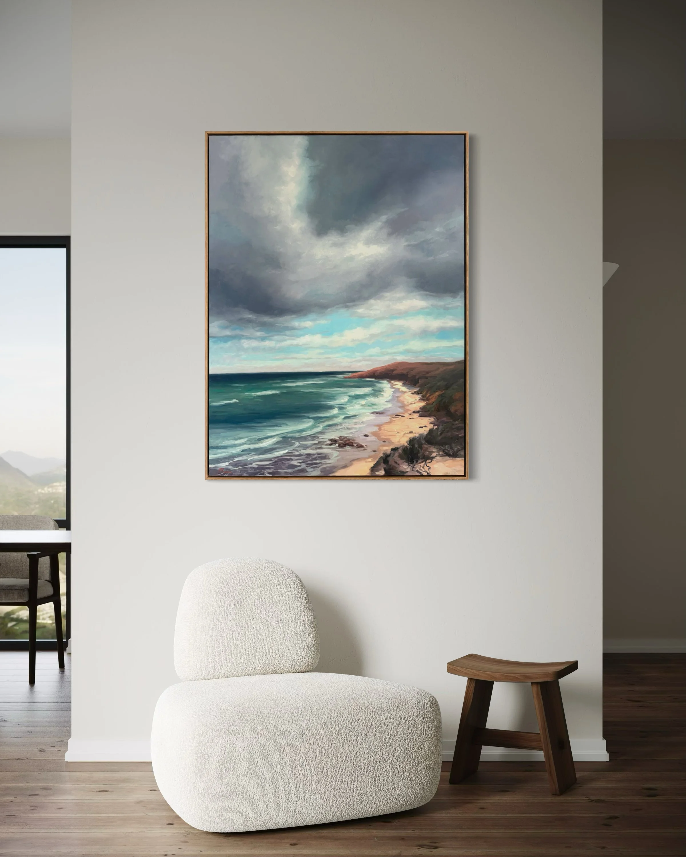 A large landscape painting in a modern home