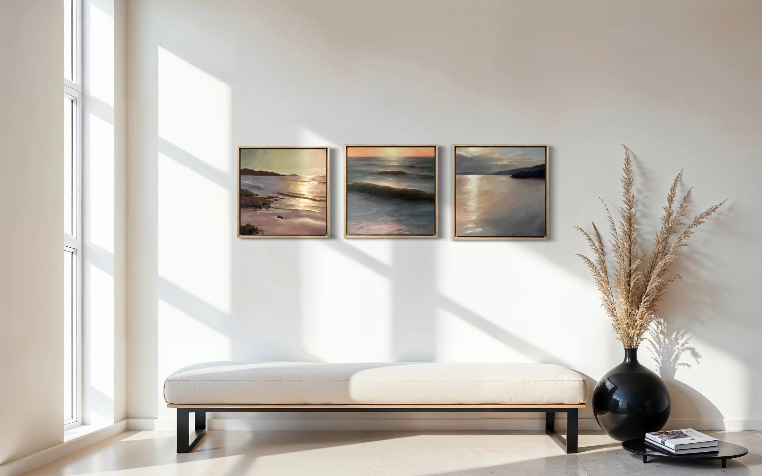 Gallery wall with four paintings in natural light