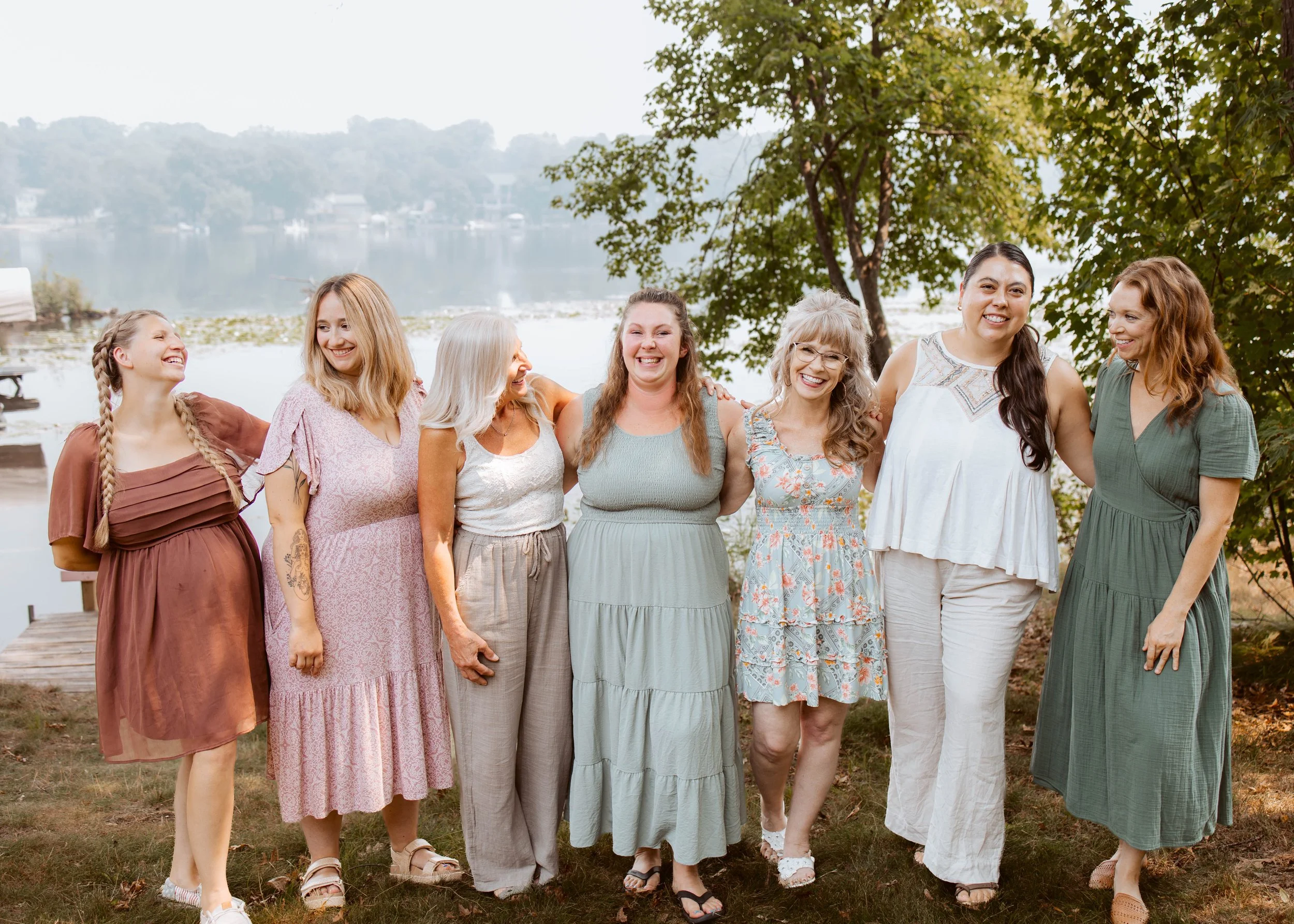 Seven Women Dressed Up Laughing Outside Team Photo