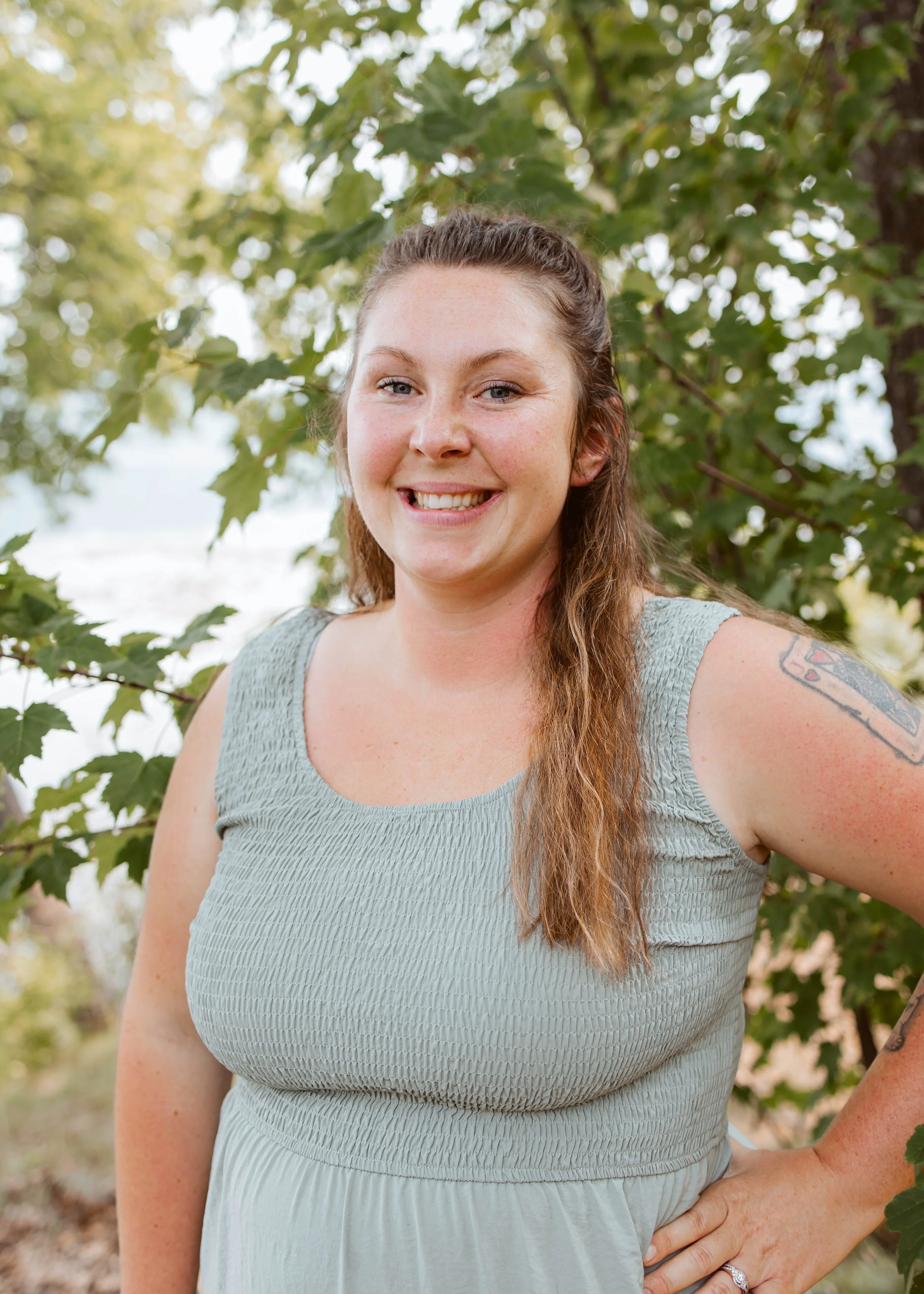 Lady Outdoors in a Dress Smiling At The Camera