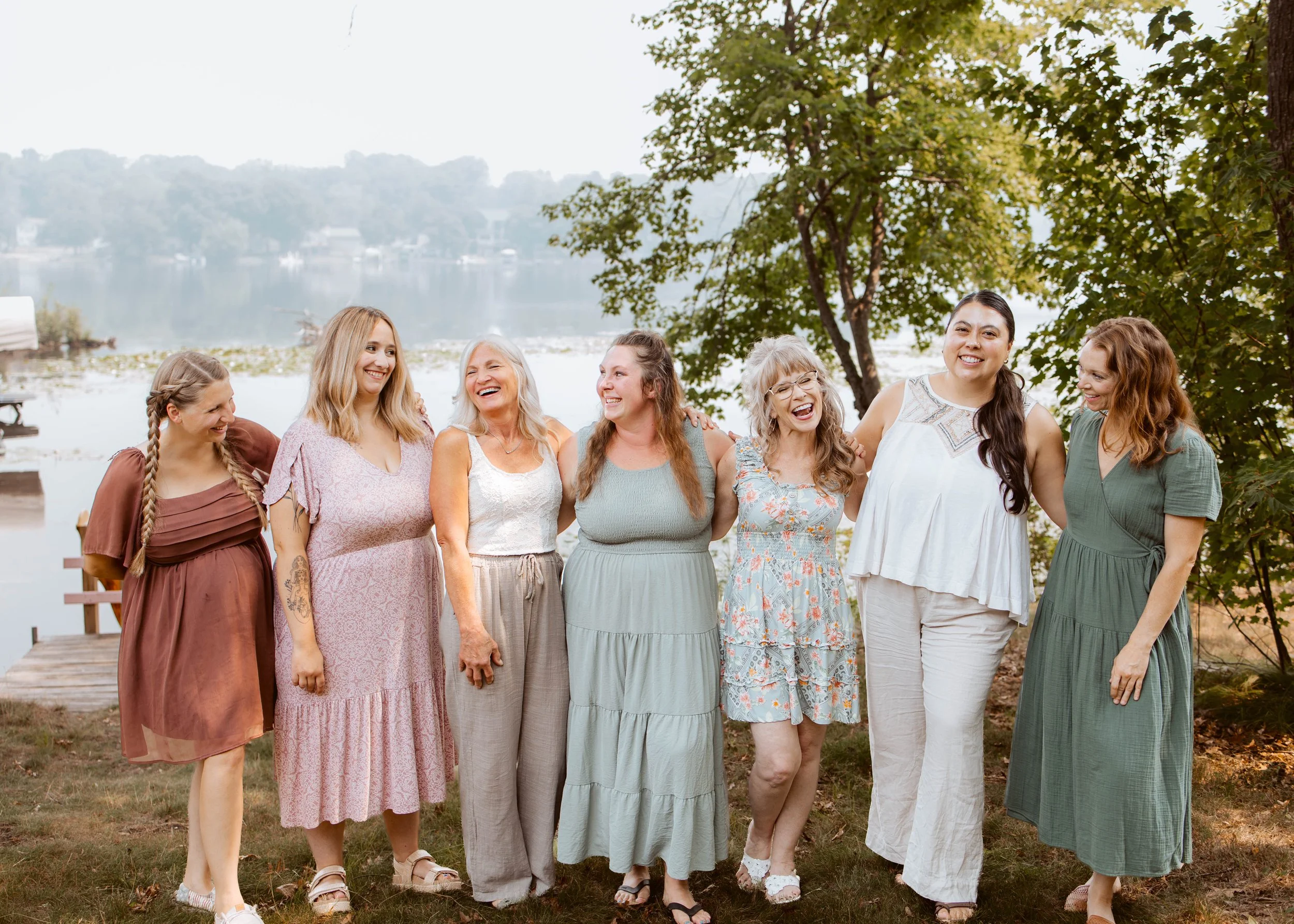 7 ladies dressed up outside by the lake
