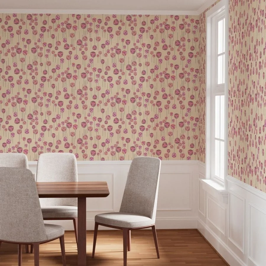 A dancing floral ditsy pattern with abstract tulips and stems on a warm yellow wallpaper in a brightly-lit dining room with wood floors, wood table, and cloth chairs