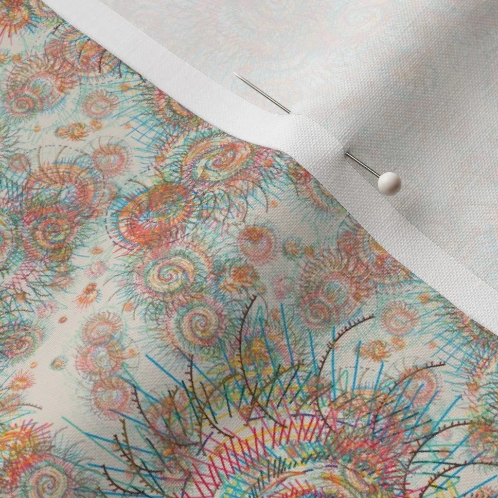 Abstract nautilus pattern on a cloth with a dress-making pin