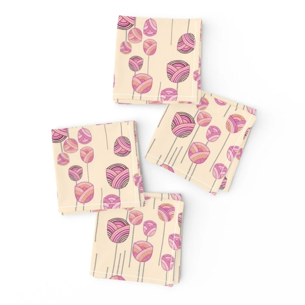 A dancing floral ditsy pattern with abstract tulips and stems on four warm yellow cloth folded napkins