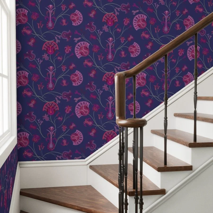 Deep blue wallpaper with glowing pink branching tulip-inspired bouquets in front of a staircase shifting up to the right with white and dark walnut steps and a window to the left