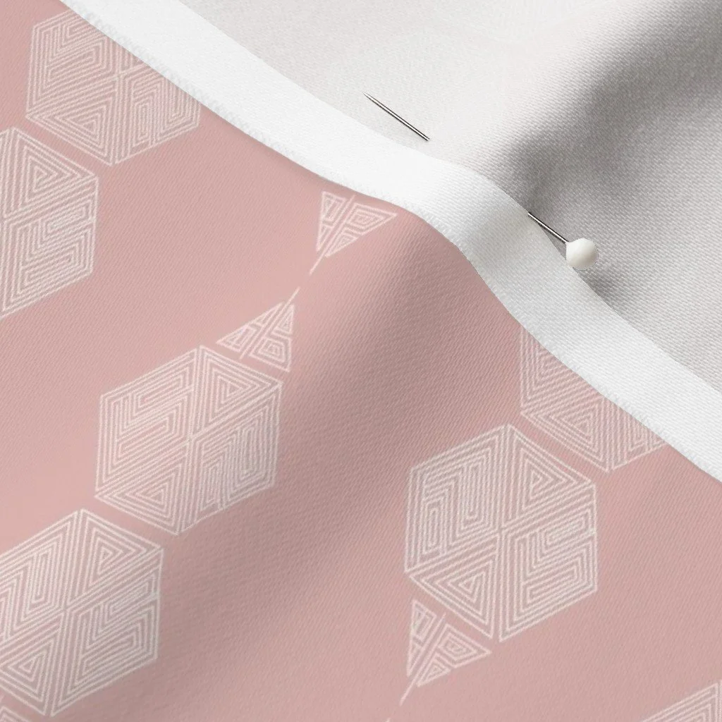 Blush pink geometric hexagon fabric with dressmaker's pin