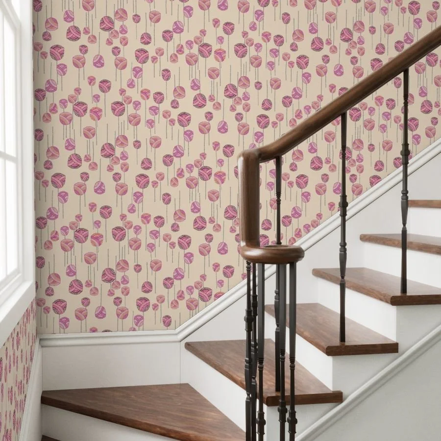 A dancing floral ditsy pattern with abstract tulips and stems on a warm yellow wallpaper behind wooden stairs curving up to the right.