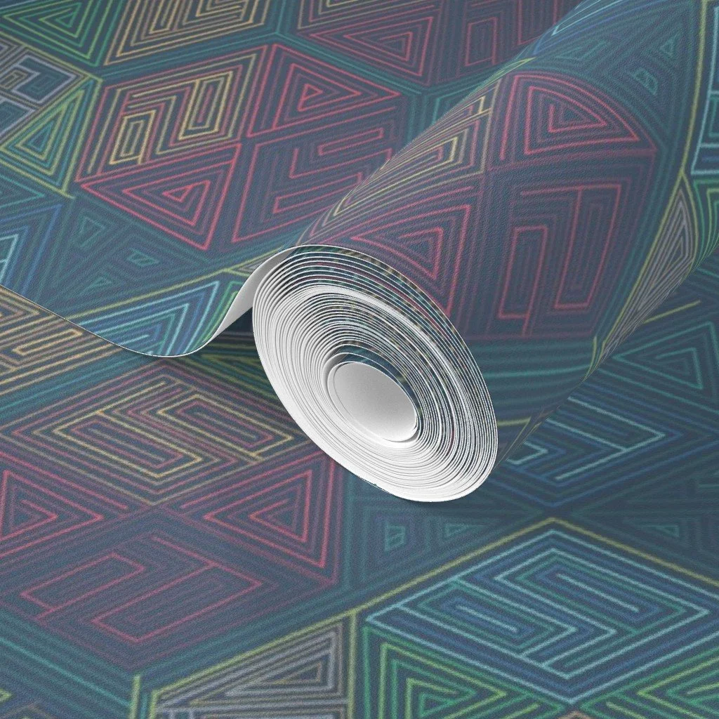 A close-up of the Rainbow Honeycomb geometric wallpaper, showing the hand-drawn hexagon repeat up close. Nested triangle and line work in teal, crimson, and ochre catch the light across a dark ground.