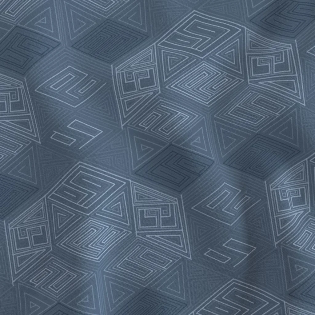 A close-up of hand-drawn hexagon fabric in slate and dusty blue, showing the nested maze-like line detail and fabric drape. The monochrome geometric repeat reads as subtle texture up close on fabric