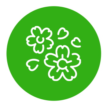 Green circular icon with white outline cartoon flowers and petals.