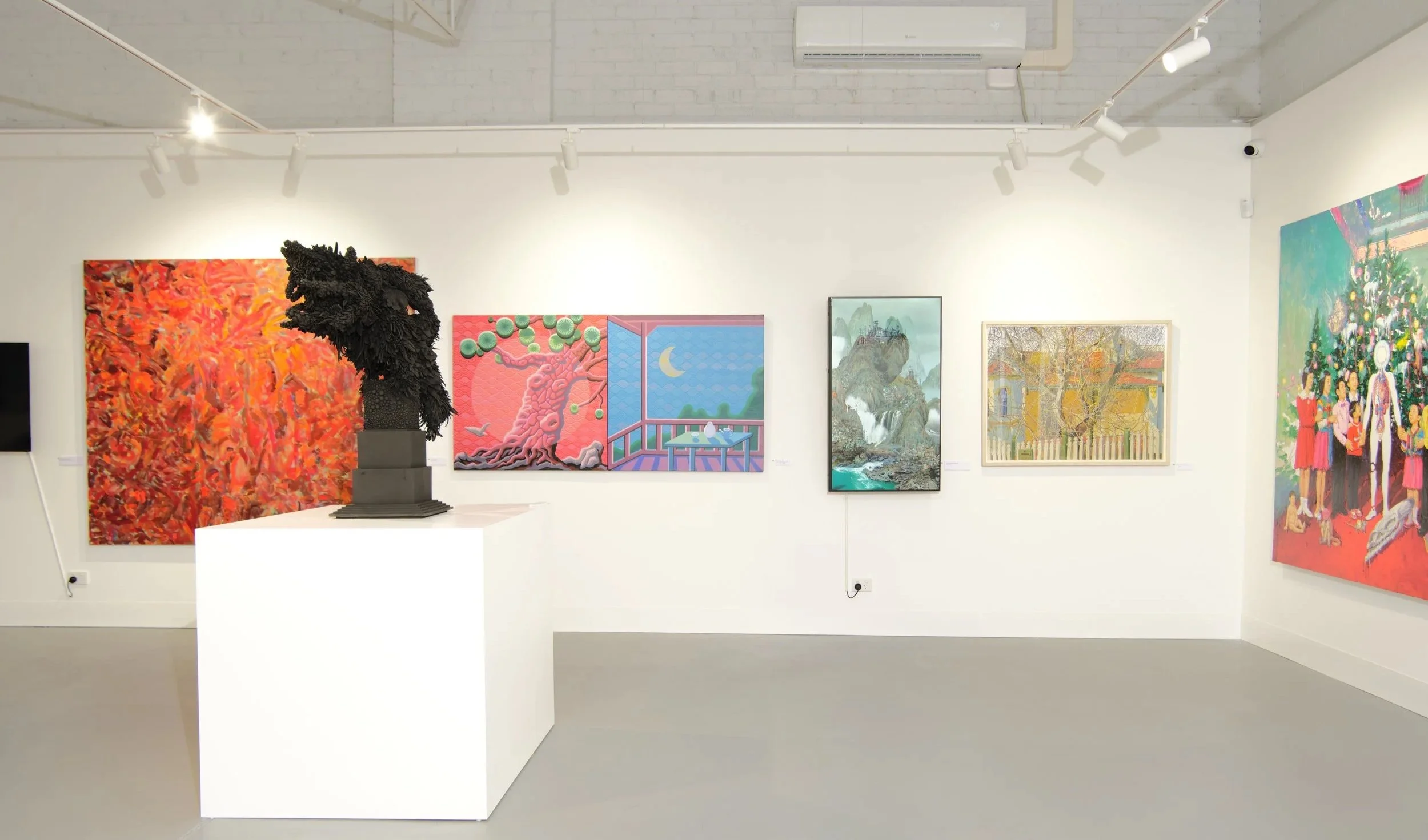 An art gallery with walls displaying colorful paintings, including abstract art, landscapes, and a depiction of a family, and a black sculpture of a dragon on a pedestal.