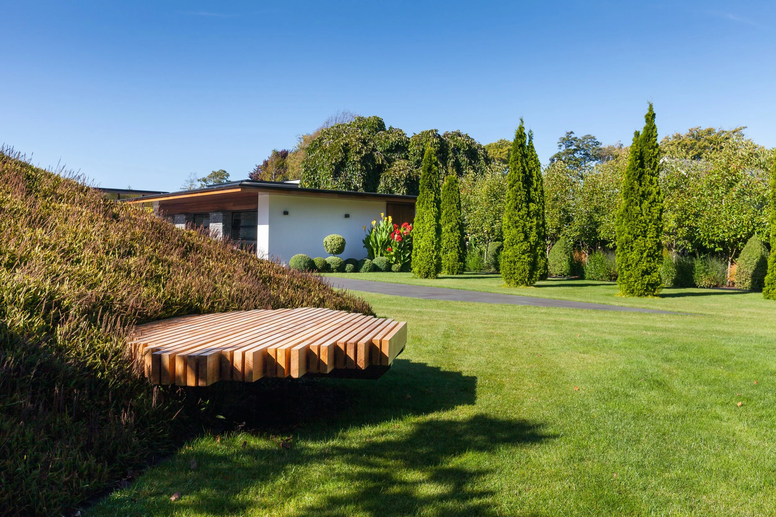 henry-blakely-landscapes-grumpys-garden-bench-feature-green-hill.jpg.jpg