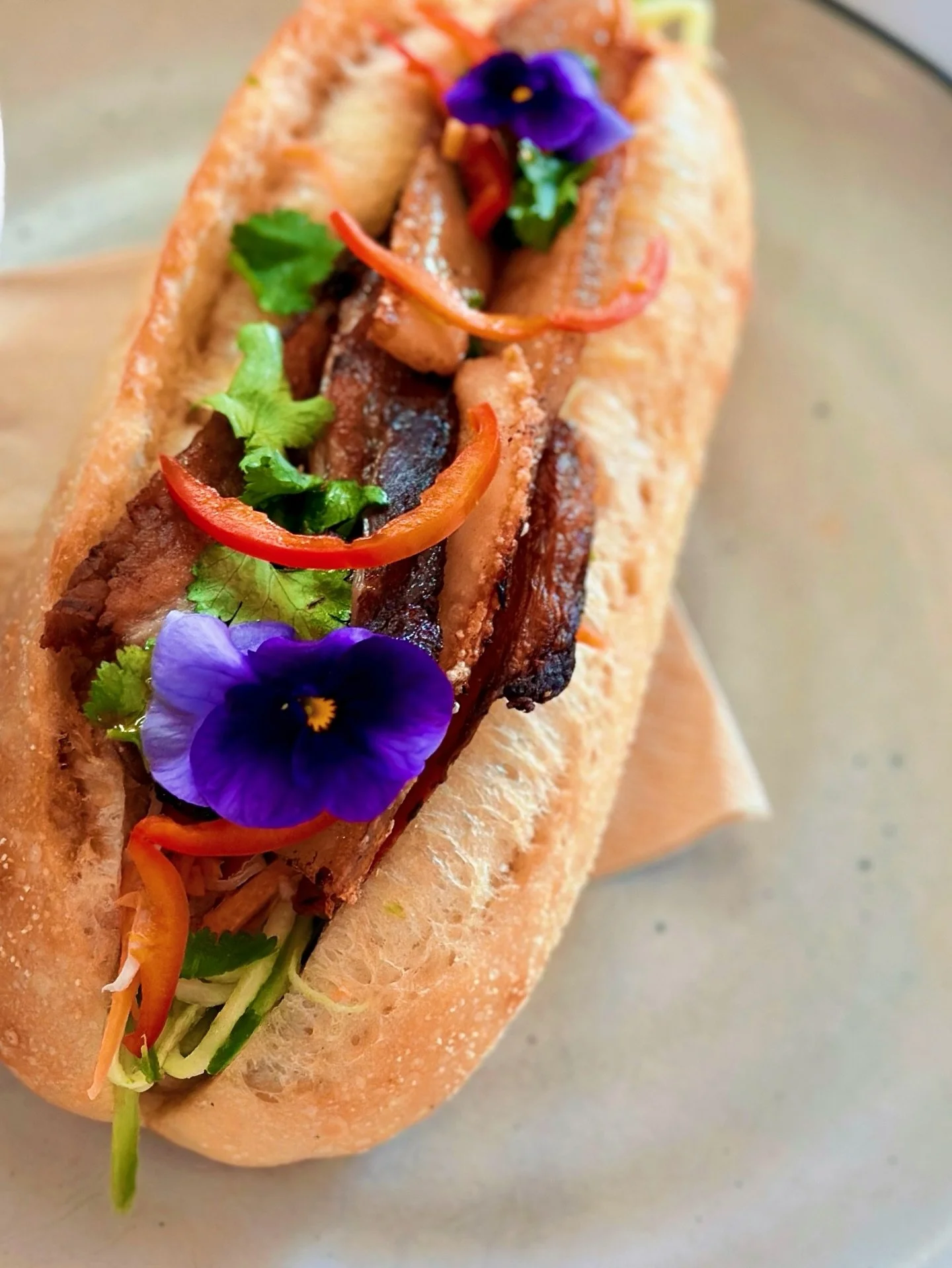 Menu fave for a reason 🤤

Braised pork belly, house-made chicken p&acirc;t&eacute;, pickled veg, herbs + chilli , all tucked into a crisp baguette.

#ToastEden #BanhMi #SapphireCoastEats #CafeLunch #EdenNSW