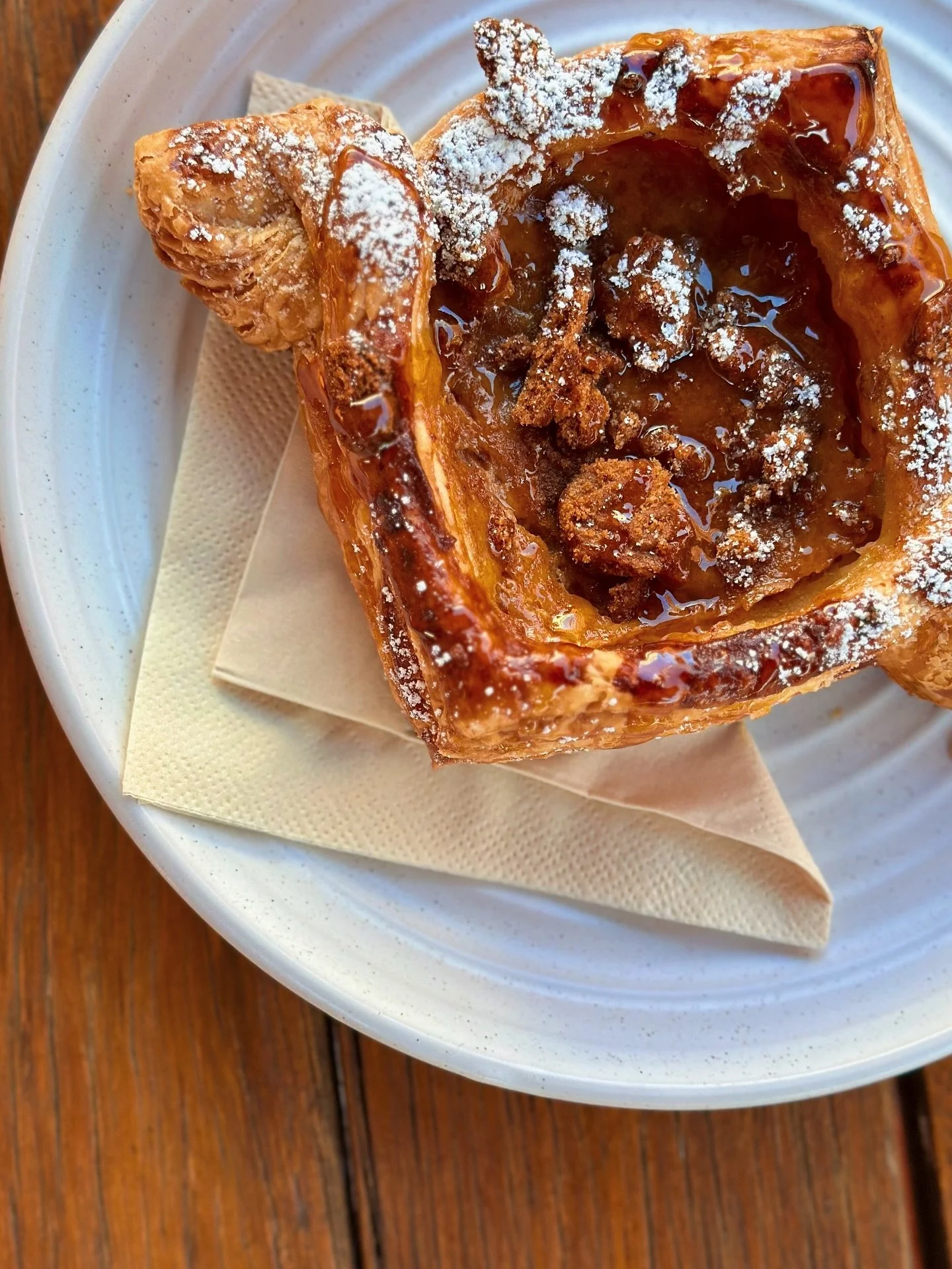 Midweek mood: toffee pudding danish, a sunny courtyard, and the passionfruit vines doing their thing. Eden in full bloom today ☀️