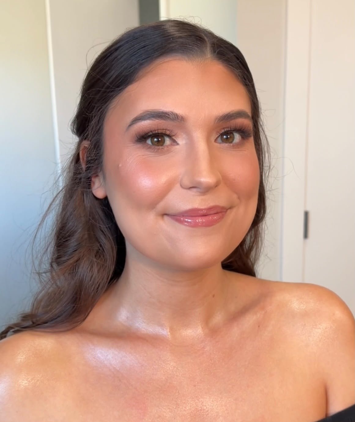 Radiant, dewy soft glam makeup and half-up hairstyle by North of Blush mobile beauty team, serving Calgary, Lethbridge, and Southern Alberta.