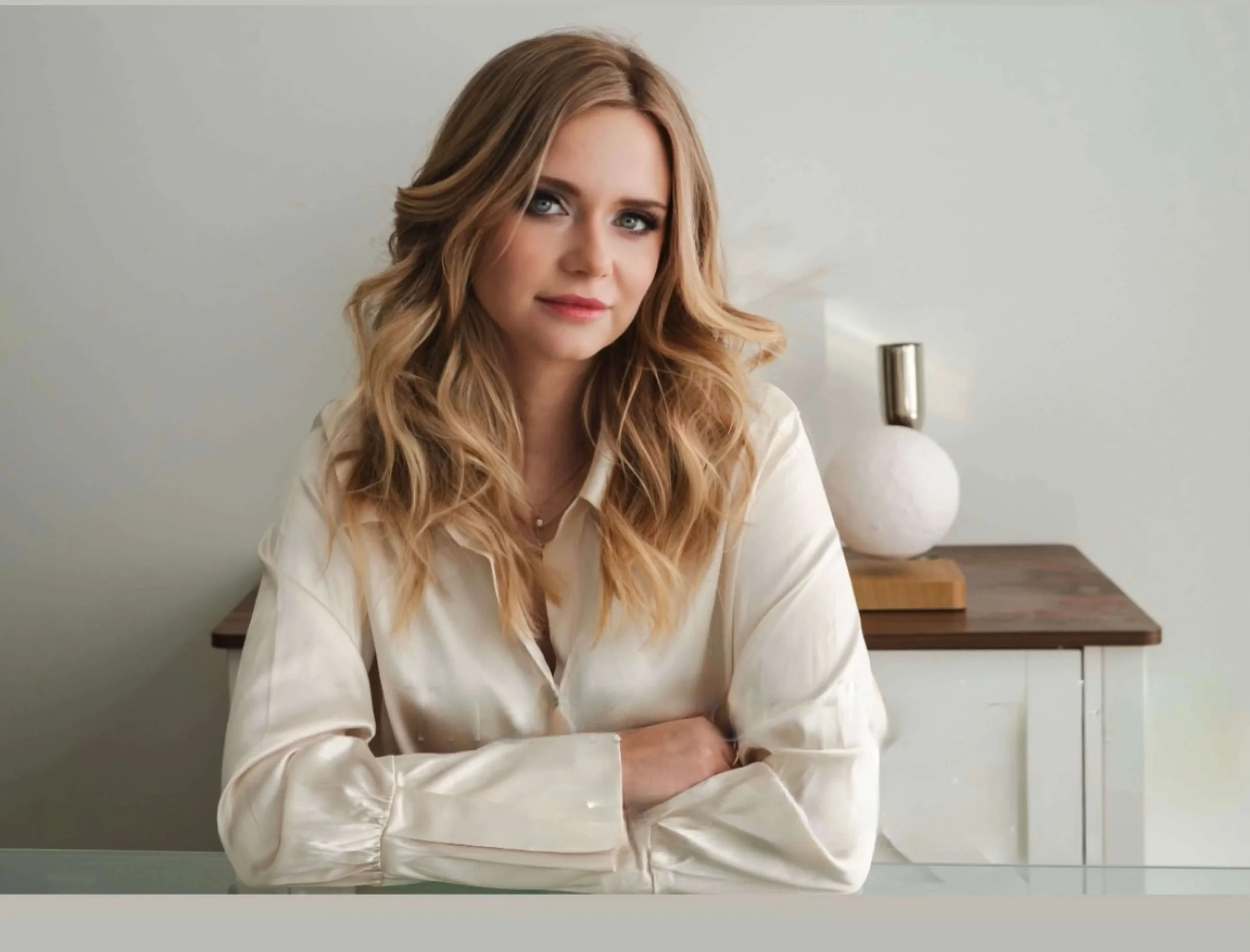 Professional hair and makeup styling by North of Blush featuring soft, elegant curls and a natural makeup look for a polished appearance.