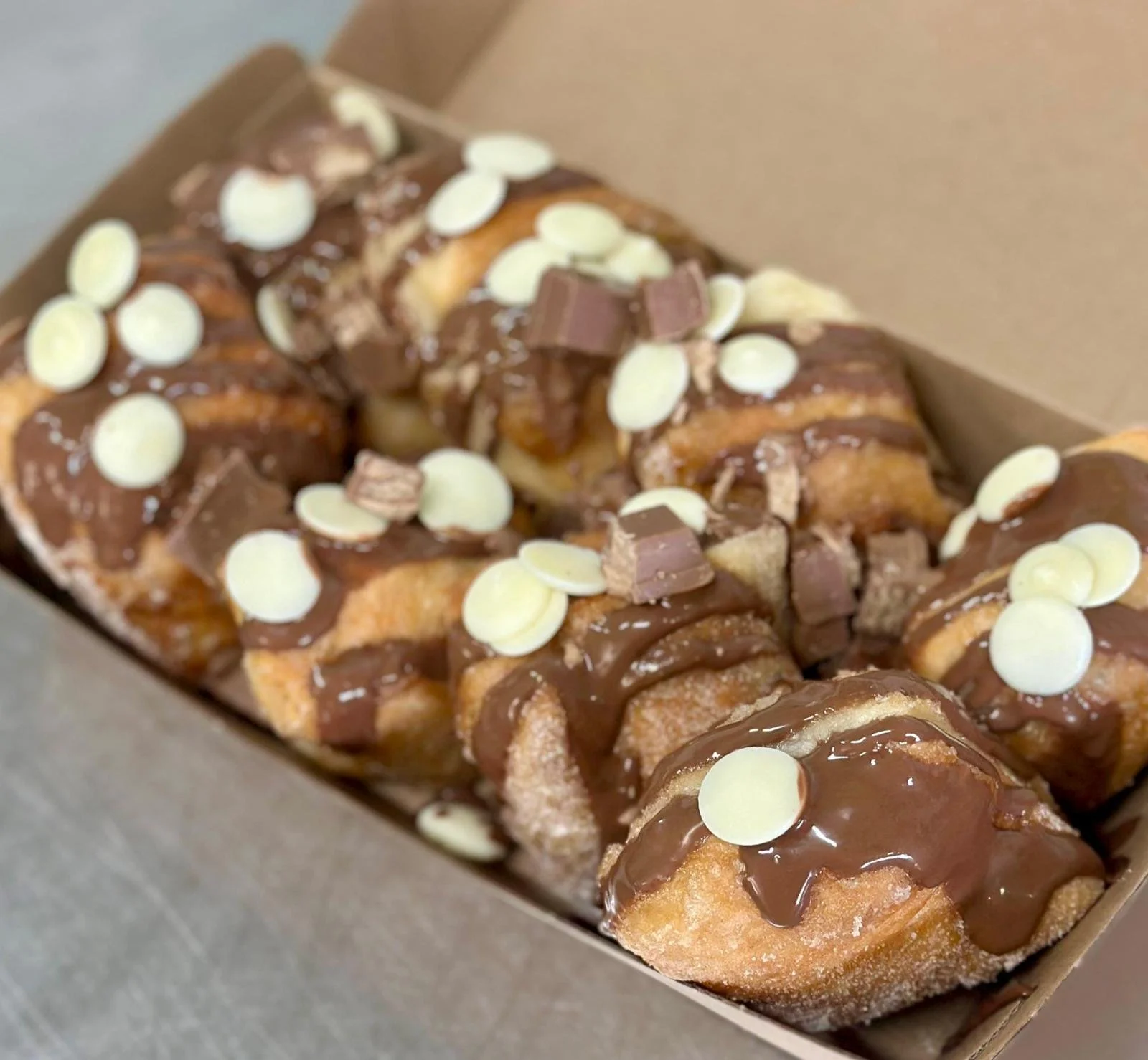 Jessie's Pizza A box of sugar-dusted churros topped with chocolate, white chocolate chips, and small chocolate pieces. best pizza in Point Cook