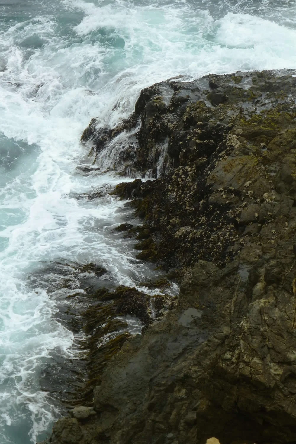 Ocean waves crashing onto Cape Mendocino - a seismically highly active and important triple junction of tectonic plates