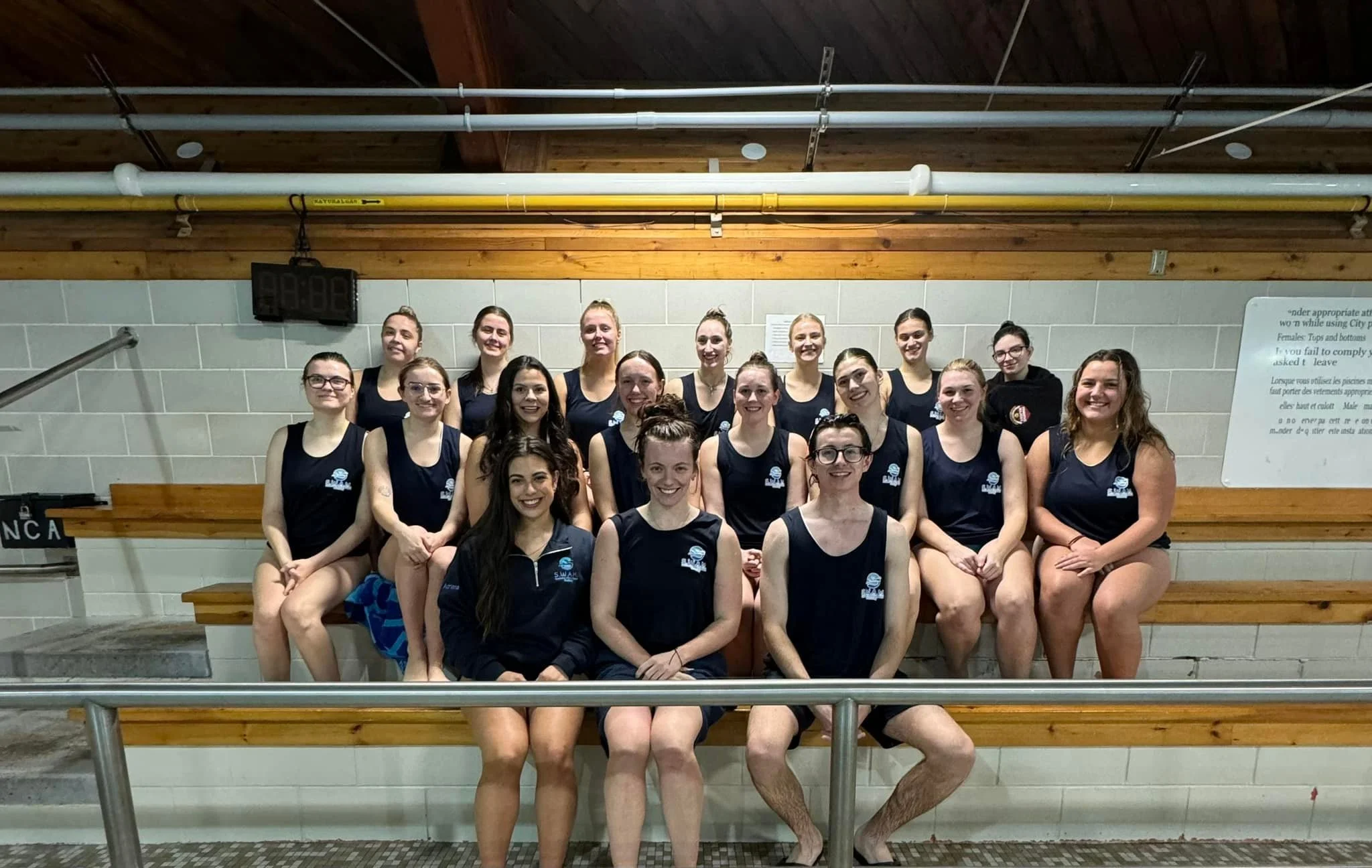 group of SWAM Sudbury volunteers sitting together and smiling