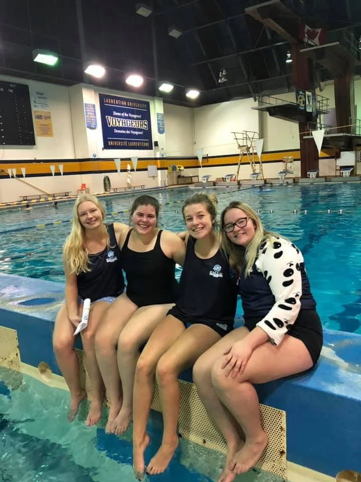 four SWAM Sudbury volunteers sitting together and smiling
