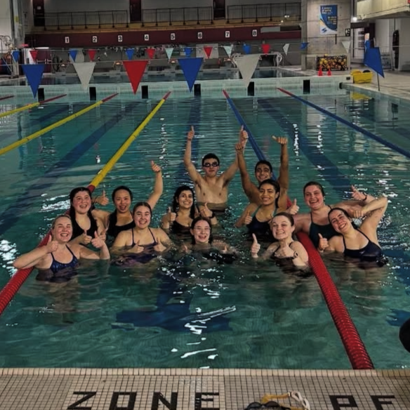 group of SWAM Ottawa volunteers, smiling and making victory signs with their hands