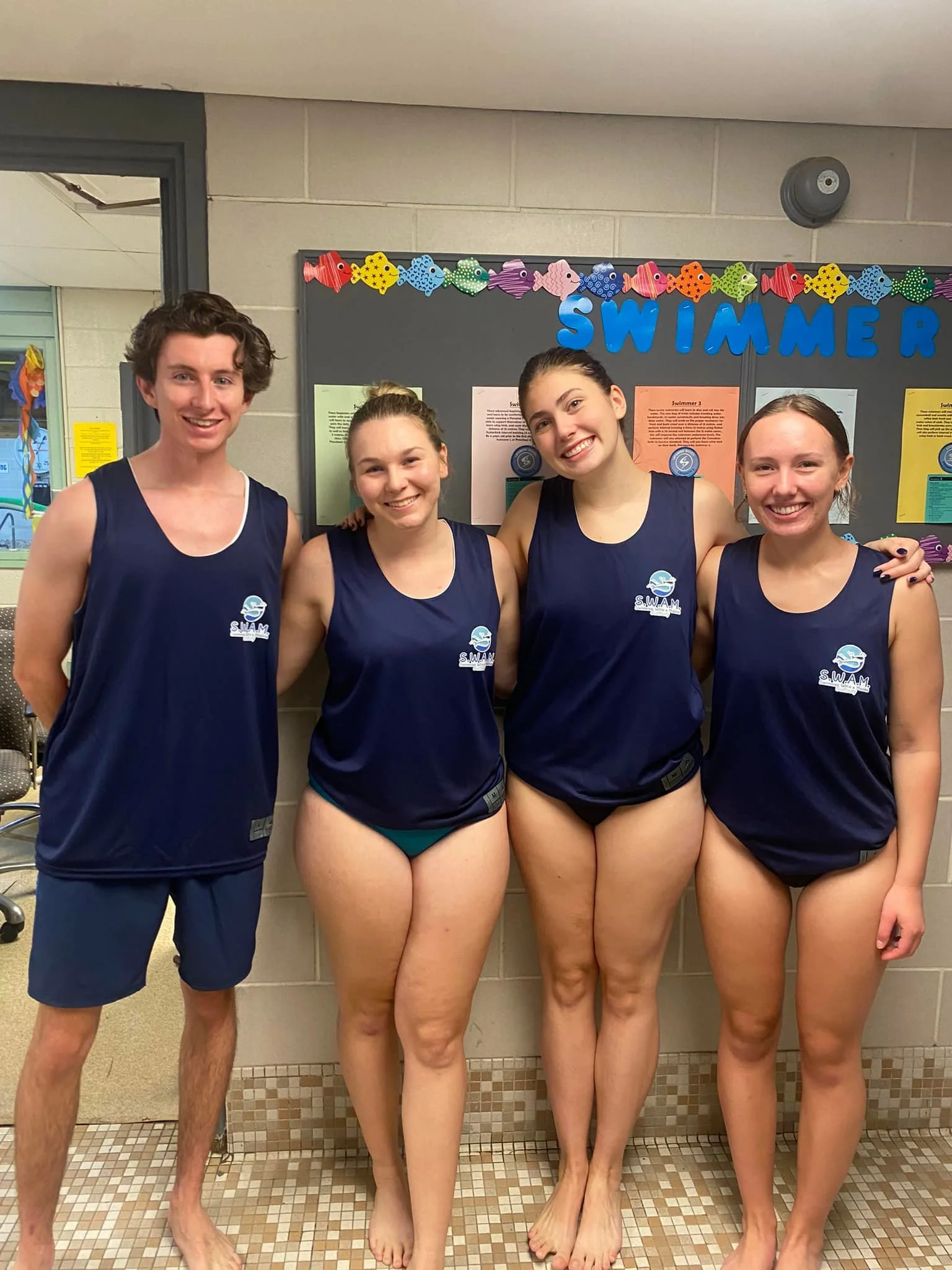 four SWAM Sudbury volunteers standing together and smiling