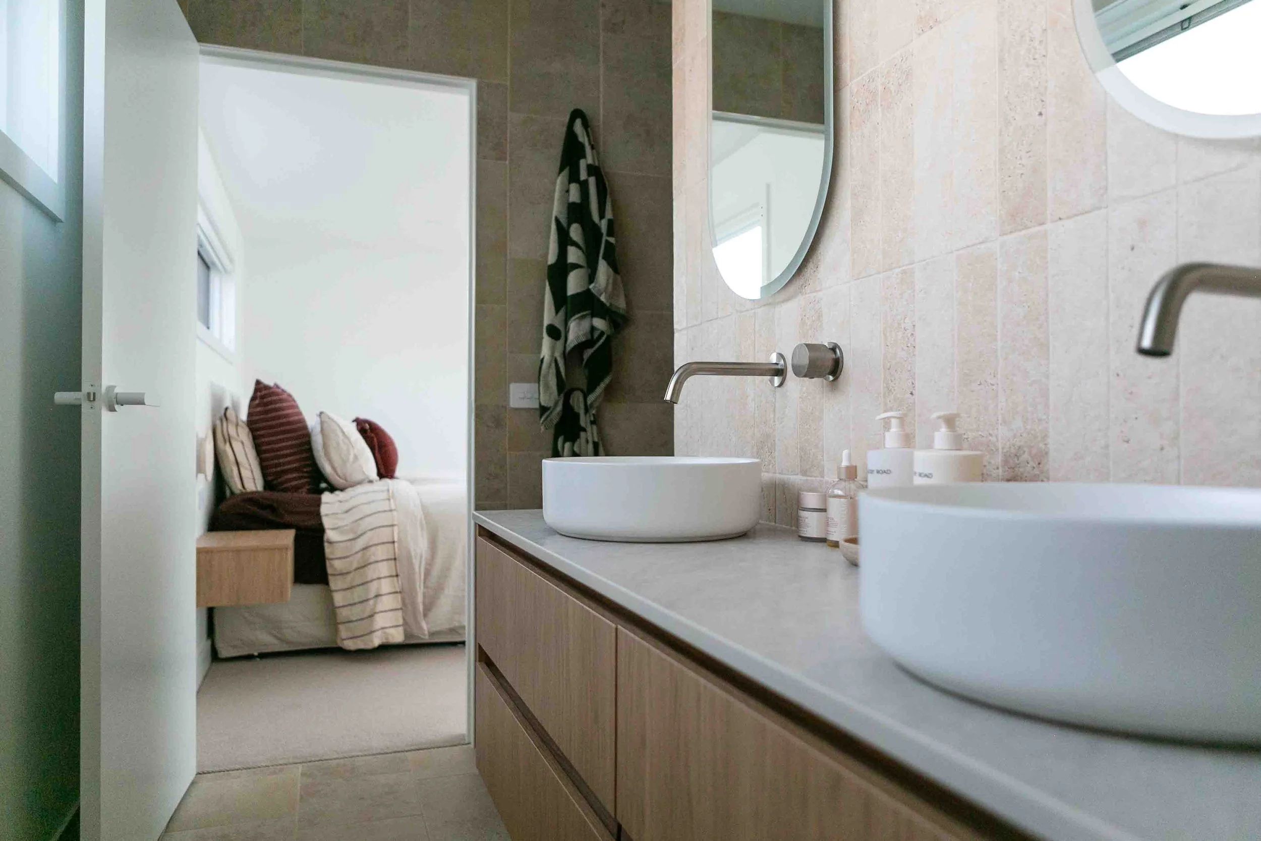 A beautifully designed ensuite bathroom off the master bedroom of a modern home built by MCC Projects