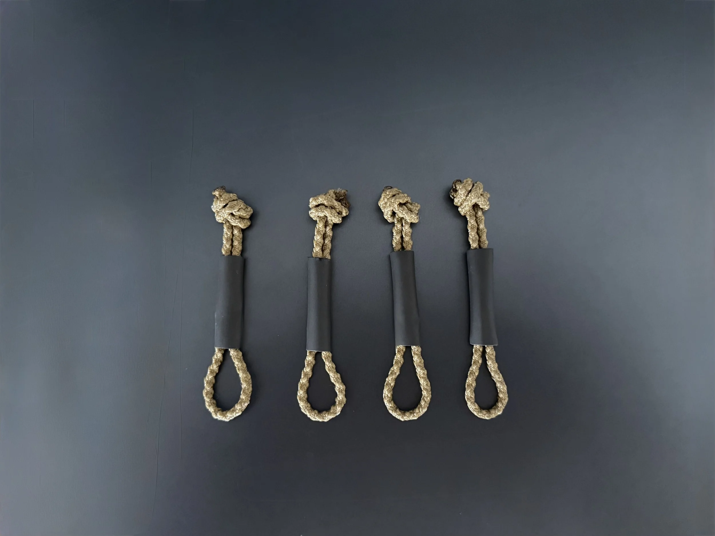 Polymetis Systems Zipper Pulls made from positive locking cord for General Purpose Tactical Pouches with additional shrink tubing for wet environments.