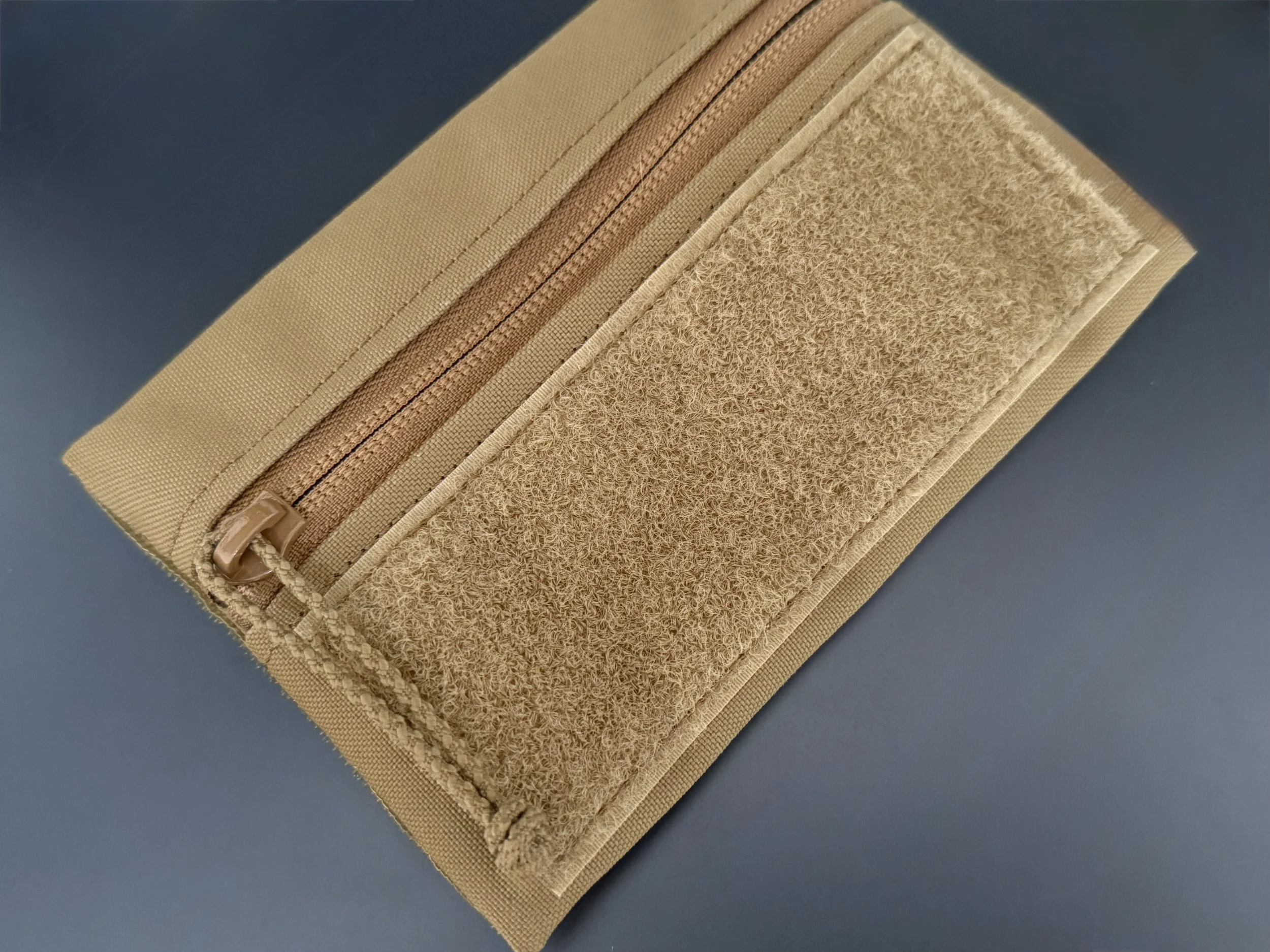 Polymetis Systems Zipper Pulls made from positive locking cord for General Purpose Tactical Pouches with additional shrink tubing for wet environments.
