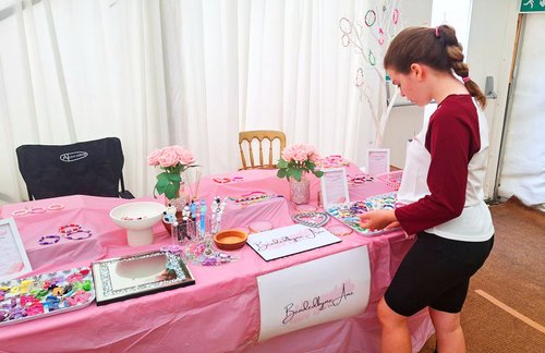 Ame with her beaded products